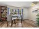 Dining area showcasing natural light, modern furnishings, and views of the landscape at 5100 Burchette Rd # 2702, Tampa, FL 33647