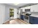 Updated kitchen featuring stainless appliances, abundant cabinetry and sliding glass door to outside patio at 5100 Burchette Rd # 2702, Tampa, FL 33647
