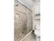 Bathroom featuring tiled shower with glass door and integrated toiletry storage at 5100 Burchette Rd # 2702, Tampa, FL 33647