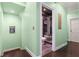 Bathroom with a glass shower stall, located near a stairway with light-green walls at 512 1St St # 108, Indian Rocks Beach, FL 33785