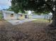 Large backyard features a concrete patio with partial fencing offering privacy and shade at 5175 88Th N Ave, Pinellas Park, FL 33782