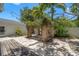 Landscaped backyard with a brick-columned pergola and a wooden picnic table at 526 36Th Ne Ave, St Petersburg, FL 33704