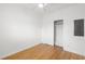 Neat bedroom featuring hardwood floors, a ceiling fan, and a closet with sliding doors at 526 36Th Ne Ave, St Petersburg, FL 33704