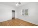 Bedroom featuring hardwood floors, closet, and a ceiling fan at 526 36Th Ne Ave, St Petersburg, FL 33704