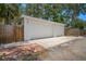A detached three car garage with concrete parking area at 526 36Th Ne Ave, St Petersburg, FL 33704