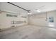 An empty garage interior with windows and a ladder at 526 36Th Ne Ave, St Petersburg, FL 33704