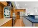 Well-lit kitchen featuring custom cabinets, a central island, and stainless-steel appliances at 526 36Th Ne Ave, St Petersburg, FL 33704