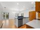 Modern kitchen boasts stainless steel appliances, a stylish island, and an open floor plan at 526 36Th Ne Ave, St Petersburg, FL 33704