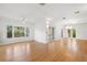 Bright and airy living room featuring hardwood floors, large windows, and modern recessed lighting at 526 36Th Ne Ave, St Petersburg, FL 33704