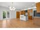 Expansive living area with a gourmet kitchen, stylish lighting, and access to outdoor spaces at 526 36Th Ne Ave, St Petersburg, FL 33704