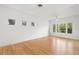 Bright living room boasts hardwood floors, neutral walls, recessed lighting, and ample windows at 526 36Th Ne Ave, St Petersburg, FL 33704