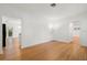 Bright living room featuring hardwood floors, neutral walls, and access to the kitchen at 526 36Th Ne Ave, St Petersburg, FL 33704