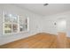 Sunlit living area showcasing hardwood floors, white walls, and a large window at 526 36Th Ne Ave, St Petersburg, FL 33704