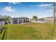 Expansive backyard with lush grass and partial fencing, ideal for outdoor activities and relaxation at 5326 22Nd N Ave, St Petersburg, FL 33710