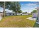 Spacious backyard featuring lush lawn, a shed, and a patio perfect for outdoor relaxation and entertainment at 5326 22Nd N Ave, St Petersburg, FL 33710