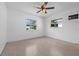 Bright bedroom with carpet, white walls and windows with neighborhood views at 5326 22Nd N Ave, St Petersburg, FL 33710