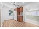 Bright kitchen with wood cabinets, white refrigerator and modern lighting at 5326 22Nd N Ave, St Petersburg, FL 33710