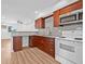 Bright kitchen with wood cabinets, granite counters, and stainless steel appliances at 5326 22Nd N Ave, St Petersburg, FL 33710