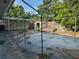Large backyard featuring a concrete slab with metal structure and perimeter fencing at 5600 9Th N Ave, St Petersburg, FL 33710