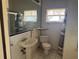 Modest bathroom featuring a pedestal sink and patterned tile flooring at 5600 9Th N Ave, St Petersburg, FL 33710
