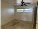 Bedroom featuring ample natural light, tile flooring, and potential closet space at 5600 9Th N Ave, St Petersburg, FL 33710
