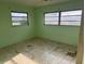 Bedroom view featuring green walls and tile flooring at 5600 9Th N Ave, St Petersburg, FL 33710