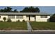 Charming single-story home with a quaint front porch and well-manicured lawn at 5600 9Th N Ave, St Petersburg, FL 33710