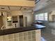Functional kitchen featuring a breakfast bar with tiled floor and ample countertop space at 5600 9Th N Ave, St Petersburg, FL 33710