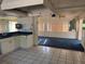 View of the kitchen featuring white cabinets and an open layout to the living space at 5600 9Th N Ave, St Petersburg, FL 33710