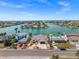 Beautiful waterfront property with lush landscaping and a private dock for boating and water activities at 600 115Th Ave, Treasure Island, FL 33706