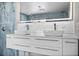 Modern bathroom featuring double vanity with vessel sinks, sleek faucet, and led mirror at 600 115Th Ave, Treasure Island, FL 33706