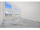 Bright bedroom with high ceilings, marble floors and ample natural light from multiple windows at 600 115Th Ave, Treasure Island, FL 33706