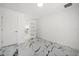 Bright bedroom with white walls, modern marble floors, and a doorway at 600 115Th Ave, Treasure Island, FL 33706