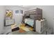 bedroom featuring a bunk bed, window, and modern marble floors at 600 115Th Ave, Treasure Island, FL 33706