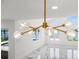 Close up of modern chandelier over living room with water views at 600 115Th Ave, Treasure Island, FL 33706