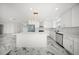 Spacious kitchen includes an island, stainless steel appliances, modern finishes, and an open layout at 600 115Th Ave, Treasure Island, FL 33706