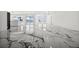 Open living space with luxurious marble floors, and view of the water at 600 115Th Ave, Treasure Island, FL 33706