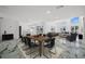 Open floor plan showcasing modern marble floors and a spacious living and dining area with water views at 600 115Th Ave, Treasure Island, FL 33706