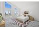 Bright main bedroom with marble floors, scenic water views, and stylish modern decor at 600 115Th Ave, Treasure Island, FL 33706
