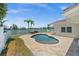 Inviting kidney-shaped pool with waterfront access and dock, perfect for relaxing and entertaining at 600 115Th Ave, Treasure Island, FL 33706