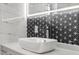 Close-up on a modern bathroom sink with unique backsplash and contemporary faucet at 600 115Th Ave, Treasure Island, FL 33706