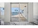 Sliding glass doors showcase pool and waterway views from the home's interior at 600 115Th Ave, Treasure Island, FL 33706