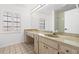 Classic bathroom featuring a long vanity, neutral finishes, and walk-in shower, blending simplicity with functionality at 629 Fort Duquesna Dr, Sun City Center, FL 33573