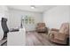Bright bedroom/office features natural light, contemporary desk, and comfortable seating creating a functional, stylish space at 629 Fort Duquesna Dr, Sun City Center, FL 33573