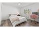 Cozy bedroom with hardwood floors, plush bedding, and a dedicated workspace, creating a welcoming and functional area at 629 Fort Duquesna Dr, Sun City Center, FL 33573