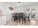 This bright dining area features a modern light fixture, and decorative painting providing a perfect space for Gathering meals at 629 Fort Duquesna Dr, Sun City Center, FL 33573