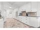 Clean kitchen with white cabinets, modern appliances, and ample counter space at 629 Fort Duquesna Dr, Sun City Center, FL 33573