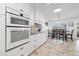 Well-equipped kitchen with a dining table and updated appliances at 629 Fort Duquesna Dr, Sun City Center, FL 33573