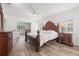 Spacious main bedroom with elegant wood furnishings offering a serene retreat for relaxation and rest at 629 Fort Duquesna Dr, Sun City Center, FL 33573
