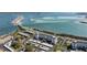 Gorgeous aerial shot of condominium complex featuring sparkling water views, beach access, and convenient parking at 7 Elgin Pl # 202, Dunedin, FL 34698